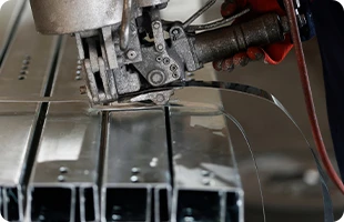Sections bundled by profile type and length using galvanized steel strip banding